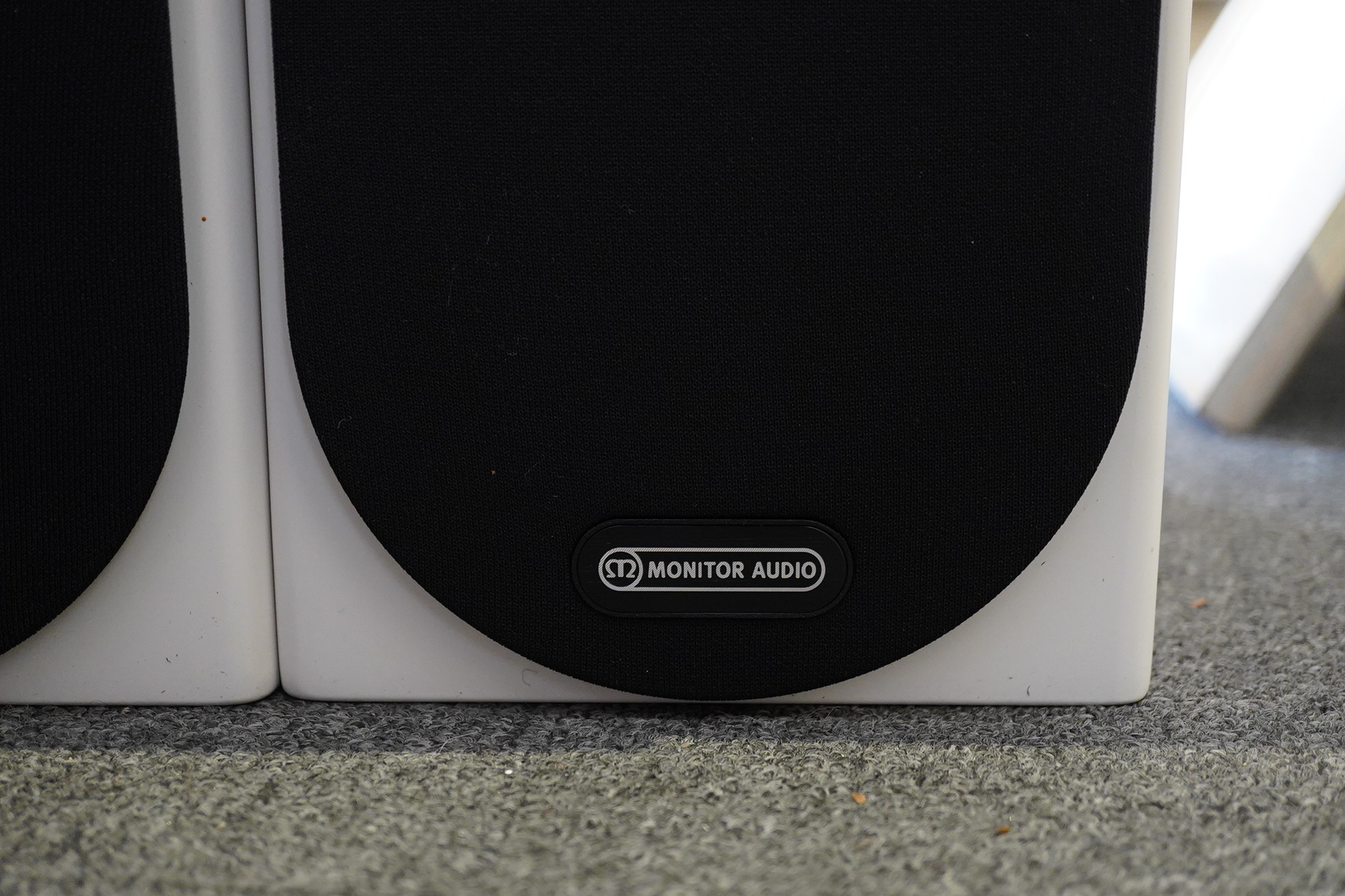 A pair of Monitor Audio Silver Series ‘Silver 50’ stereo monitor speakers in satin white cases, height 27cm, width 16.5cm, depth 25cm, together with the silver series specification booklet and two related audio cables